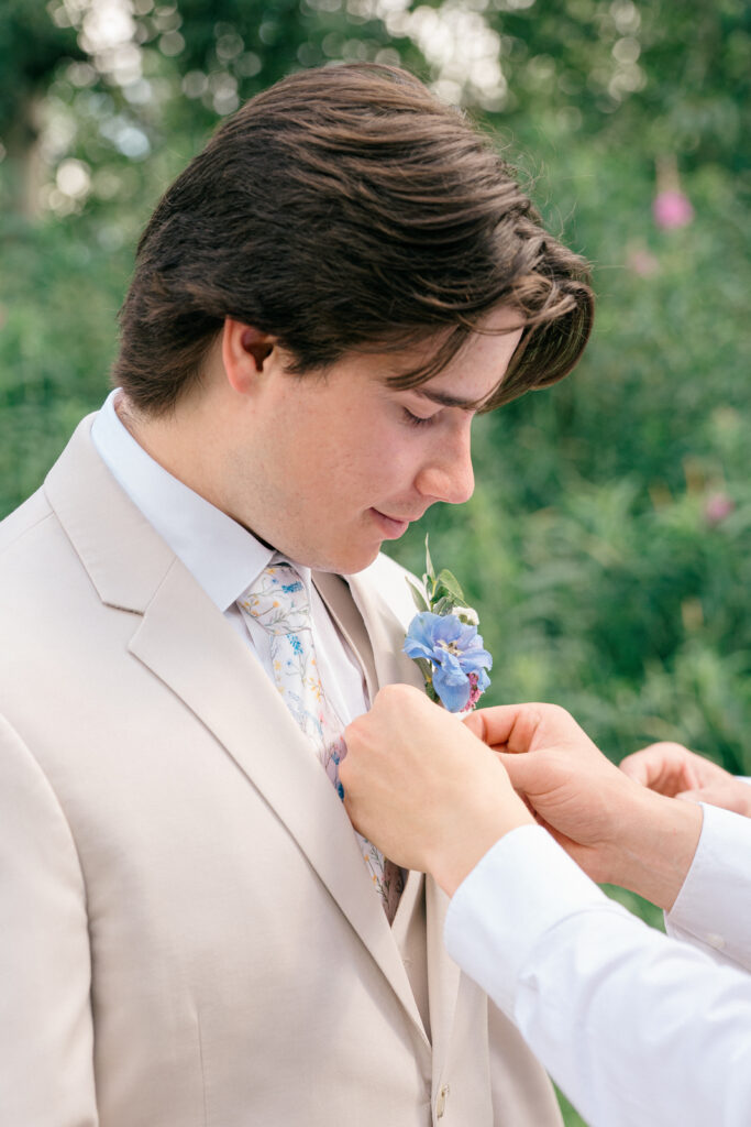 Pastel wedding inspiration groom in beige suit at Mountain Field Farms, Palmer Alaska