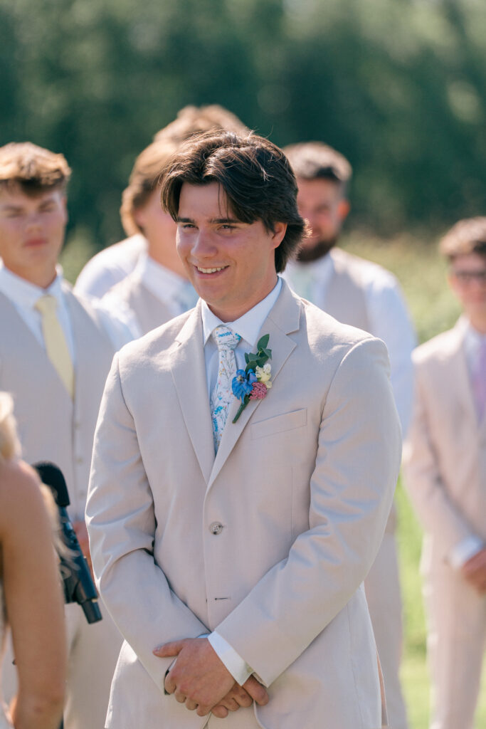 Outdoor summer wedding ceremony with mountain views at Mountain Field Farms, Alaska wedding